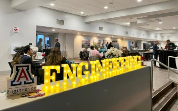 A yellow neon sign reads "engineering."